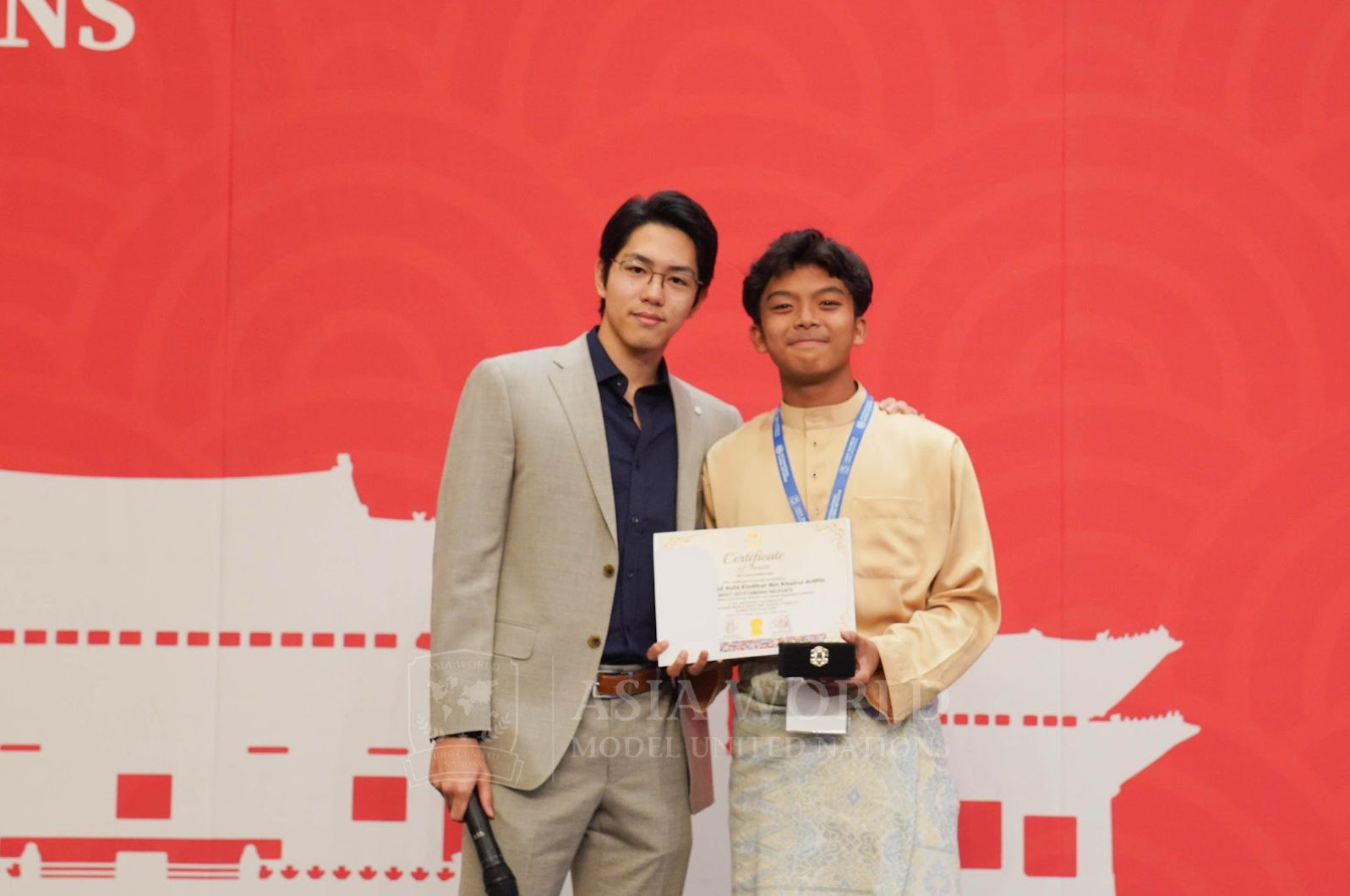 Aufa receiving Most Outstanding Delegate award at Asia World MUN 10
